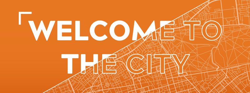 Welcome to the City logo on orange and white city map