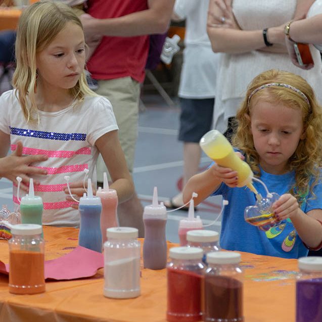 Kids do arts and crafts at the Kids Carnival at Reunion 2018