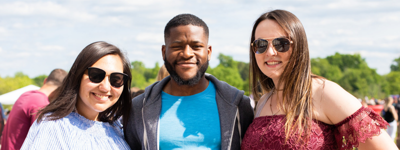 three young people smiling