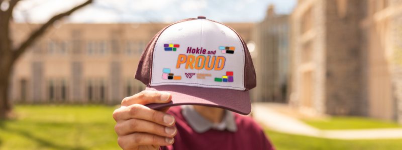 A maroon and white Hokie and Proud hat
