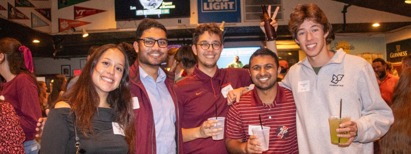 Young alumni at happy hour