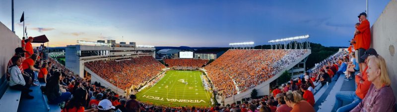 A view from the top of Lane Stadium at dusk during a football game
