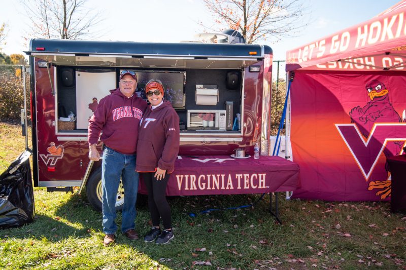 Two Hokies at a tailgate